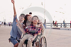 Diverse families with disable child photo